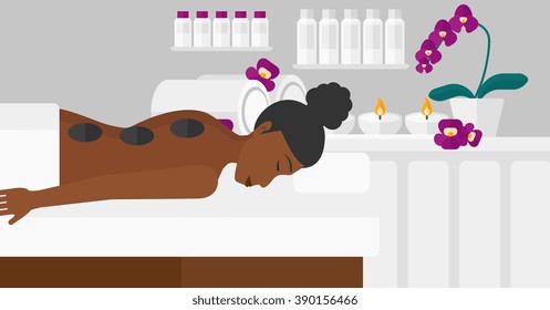 Woman getting stone therapy.