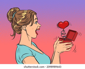 a woman girl looks at a red heart box valentine surprise greeting, love romance. Pop Art Retro Vector Illustration 50s 60s Vintage kitsch Style