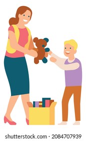 Woman giving toy to child. Person sharing books for charity