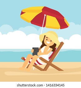 Woman go to travel in summer holiday,Beautiful girl tanning and using tablet computer, relaxing under sun umbrella