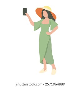 A woman in a green dress is holding a cell phone and wearing a straw hat. She is posing for a picture