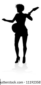 A woman guitarist musician in detailed silhouette playing her guitar musical instrument.