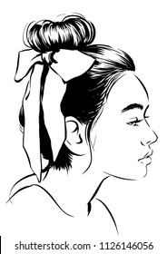 Woman with hair bun and bow