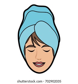 woman with hair wrapped in towel with pleasure showing on her fa