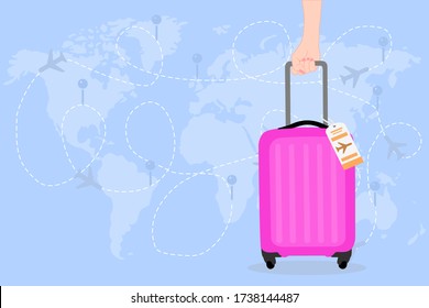 Woman hand is holding a pink Travel bag with airline tag on the world map and has airplane. Vacation time around the world. Enjoy international trip . Tourism, Journey concept. 