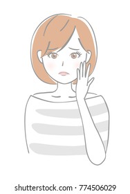 A woman with a hand on her cheek