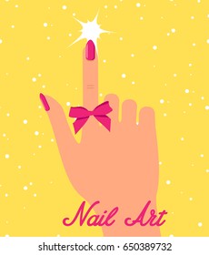 Woman hand with pink fingernails and pink bow on yellow background.