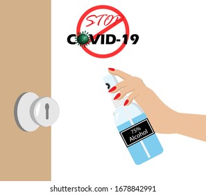 Woman hands apply 75% Alcohol spray on door knob to protect from COVID-19 corona virus spreading. Idea for COVID-19 corona virus outbreak, awareness and prevention. 