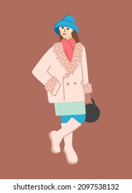 A woman in a hat, an elongated coat, a narrow mini skirt, and high boots. A girl in winter clothes in boho style.