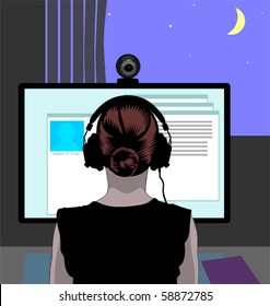 Woman in headphones in front of her computer communicating via web camera, the blue night sky with a crescent seen in the window.