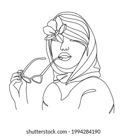 Woman in a headscarf with glasses one line vector drawing.Woman in a headscarf with glasses