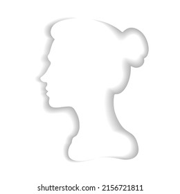 A woman with her hair pulled back.Paper cut style.Face silhouette.Profile portrait of a female character.Origami silhouette.Craft paper cut art illustration.Profile shadows on a white background.