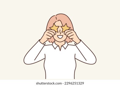 Woman hides eyes behind stars demonstrating assessment of quality of service in restaurant or store to share user experience. Concept of participation in rating or work as mystery shopper