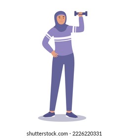 Woman in hijab and sport clother doing sport with dumbbell. Physical activity and sport lifestyle for muslim women.
