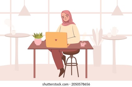 Woman In Hijab Working At Cafe. Empowered Business Woman Working On Laptop. Muslim Student With Laptop In Cafe