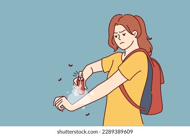 Woman hiker applies anti-malarial mosquito bite spray while hiking in wilderness in tropical area. Girl uses remedy for flying insects or ticks with mosquito that can infect person with infection 