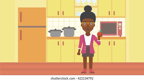 Woman holding apple.