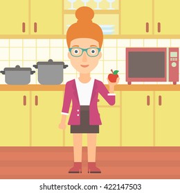 Woman holding apple.