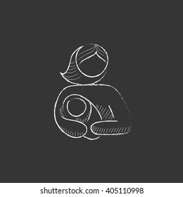 Woman holding baby. Drawn in chalk icon.