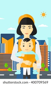 Woman holding baby in sling.