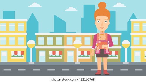 Woman holding baby in sling.