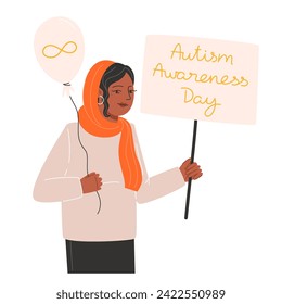 A woman holding a balloon and a gold infinity symbol poster for Autism Awareness Day