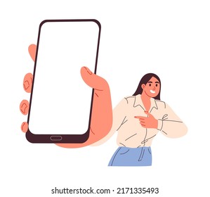 Woman holding big smartphone with blank screen in hand.