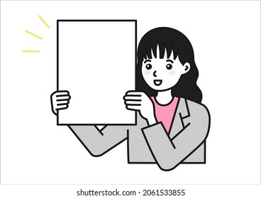 A woman holding up a board to make a presentation