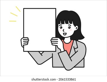 A woman holding up a board to make a presentation