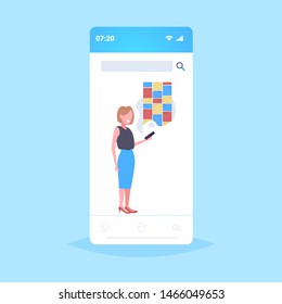 woman holding cellphone using notes. digital online mobile application .creative organizer reminder concept smartphone screen full length flat.
