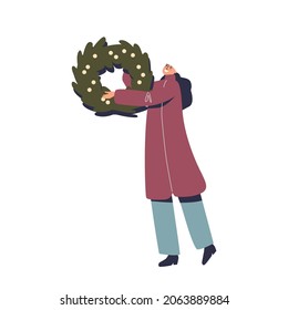 Woman holding Christmas wreath of spruce branches for house outside decoration. Female prepare for new year and xmas holidays decorating. Cartoon flat vector illustration