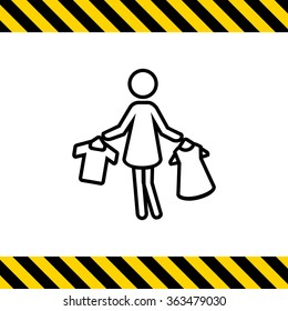 Woman holding clothes on hangers