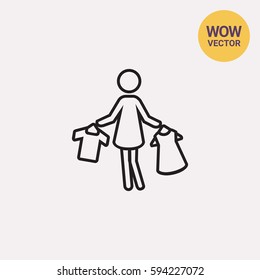 Woman holding clothes on hangers