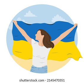 woman holding the flag of Ukraine against the blue sky and field