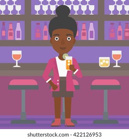 Woman holding glass of juice.