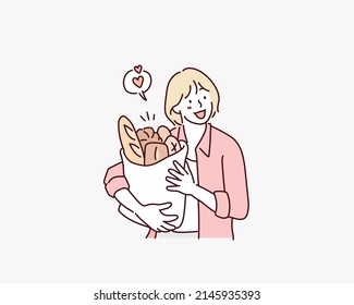 mujer sosteniendo una bolsa de comestibles llena de pan fresco. Ilustraciones de diseño vectorial de estilo dibujado a mano.