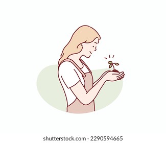 Woman holding in hands green sprout seedling on black soil. Hand drawn style vector design illustrations.