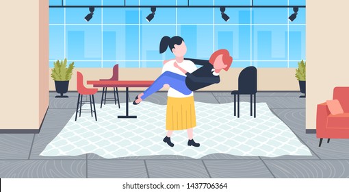 woman holding her girlfriend lesbians couple in love lgbt pride festival concept girls having fun modern living room interior horizontal full length flat
