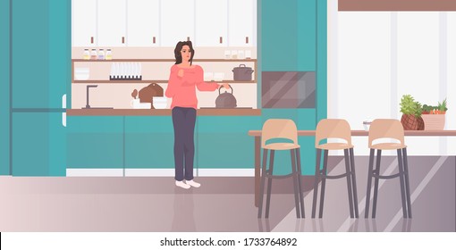 woman holding kettle girl preparing hot drink stay home coronavirus pandemic quarantine concept modern kitchen interior full length horizontal vector illustration