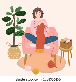 woman holding knitting needles and yarn knits. Knitting hobby. Woman activity, profession