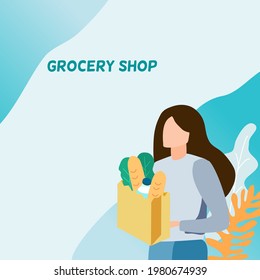 A woman holding paper bag with bread , vegetable, bottle water in her hand and blue ombré background. Grocery shop online concept can add your text.