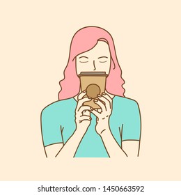 Woman holding a plastic cup of fresh milk and brown sugar boba/bubble drinks.