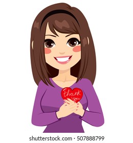 Woman holding red heart with thank you text