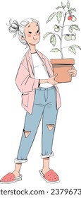 woman holding seedlings in her hands