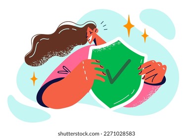 Woman holding shield with green check mark feels security after purchasing antivirus that protects against threats. Concept digital security and rescue from viruses ransomware and cyber criminals