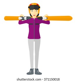Woman holding skis.