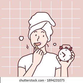 Woman holding a toothbrush, toothpaste and a clock. Hand drawn style vector design illustrations.