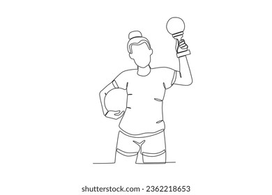 A woman holding a trophy and a ball. Spain's women's football team victory