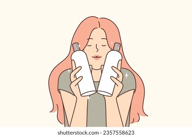 Woman is holding two bottles of shampoo and conditioner to wash hair and create lush beautiful hairstyle. Girl closes eyes, recommending use of shampoo to get rid of dandruff or oil on hair