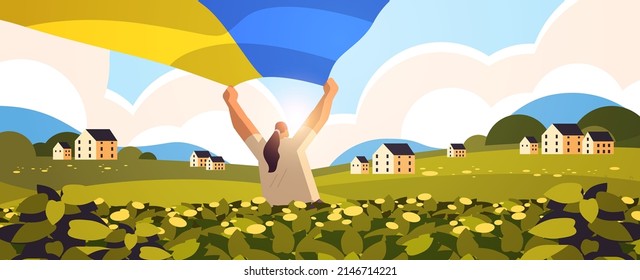 woman holding Ukrainian flag outdoor pray for Ukraine peace save Ukraine from russia stop war concept